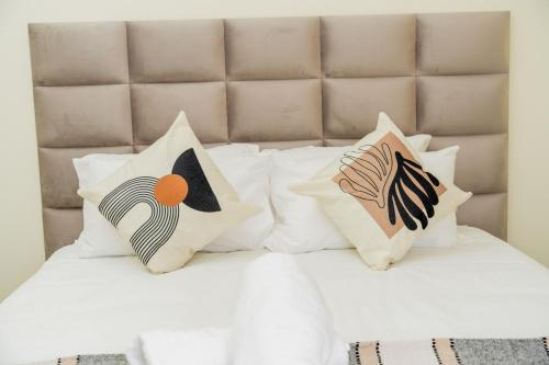Cama o camas de una habitación en Palm Nest