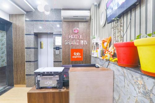 a fast food restaurant with a sign on the wall at Hotel G Inn I in Lucknow