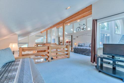 a room with a bed and a tv and a bedroom at Red Cedar - Unit 30 in Sunriver