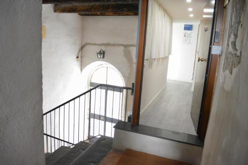a staircase in a building with an archway at al larghetto n5 in Salerno