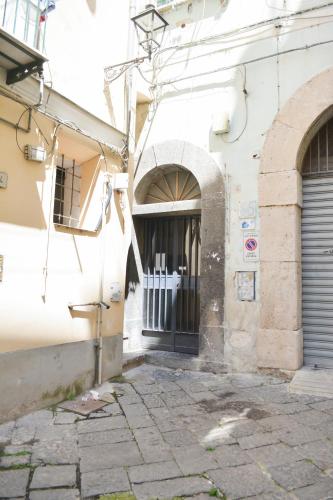 an alley with a gate in a building at al larghetto n5 in Salerno