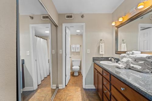 a bathroom with a sink and a toilet at Perdido Sun 1010 in Perdido Key
