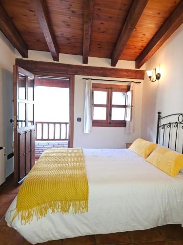 Posteľ alebo postele v izbe v ubytovaní Casa Rural El Campanario