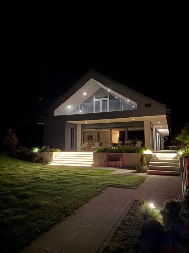 a house at night with lights on the lawn at Smart & Wellness Villa in Ptuj