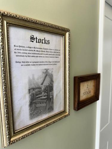 a framed picture of a train on a wall at Black Horse in Brent Pelham