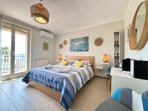 a bedroom with a bed and a tv in a room at Villa Artemis in Graniti