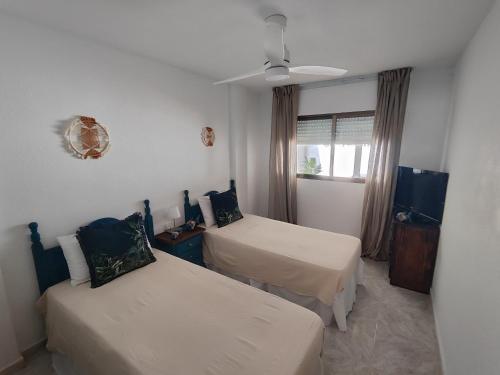 En eller flere senge i et værelse på Casa Antonio