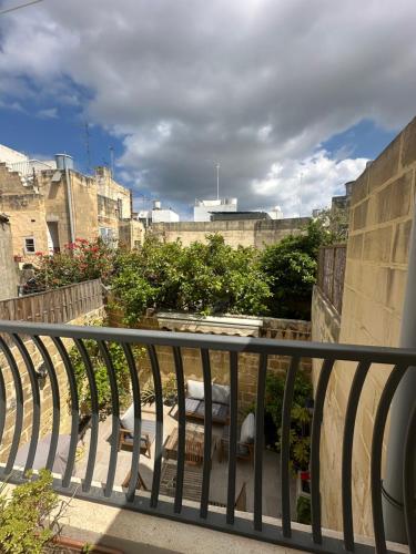 a view of a city from a balcony at Iris -Paola Modern Townhouse in Paola