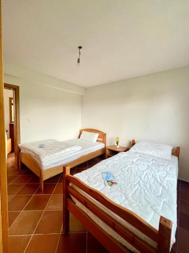 Ένα ή περισσότερα κρεβάτια σε δωμάτιο στο Villa FIAMMA MEDJUGORJE