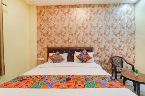 Una cama o camas en una habitación de Hotel G Inn