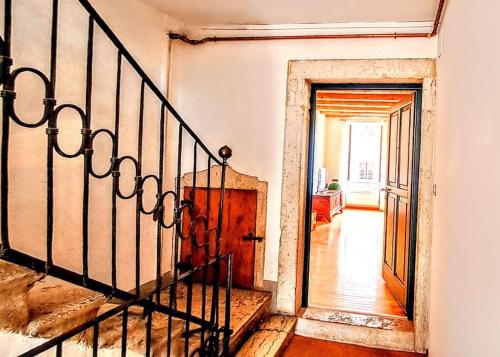 a staircase leading to a room with a door at IL CUORE glamour DEL FESTiVAL -100mq con JACUZZi- in Trento