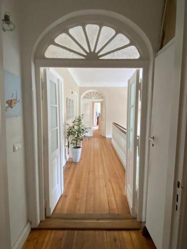 an open hallway with a potted plant in a house at Bauernhofvilla nur für Frauen Woman only in Niemegk