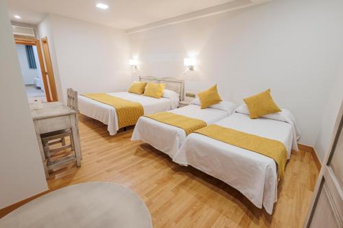 Postel nebo postele na pokoji v ubytování Hotel Pattaya