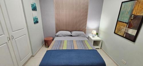 Katil atau katil-katil dalam bilik di Tocumen Airport Los Corcho Suites