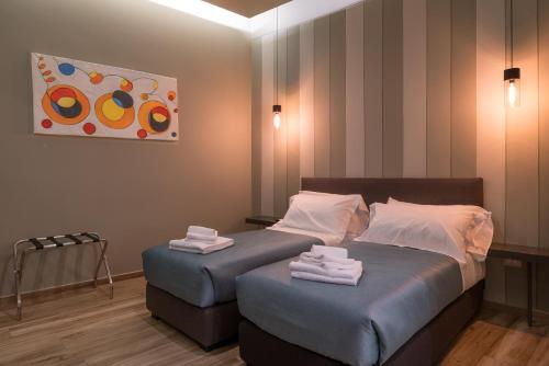 Postel nebo postele na pokoji v ubytování GOGO` Petit Hotel