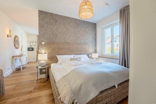 Katil atau katil-katil dalam bilik di SCHLOSSBERG RESIDENCES - Betthupferl Luxury City-Apartments Aschaffenburg