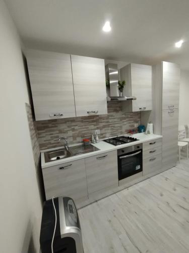 Kuchyň nebo kuchyňský kout v ubytování Casa Orchidea - Comfort minimal nel cuore di Palazzolo Acreide