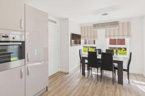 a kitchen and dining room with a table and chairs at Host & Stay - Orient House in Yarm
