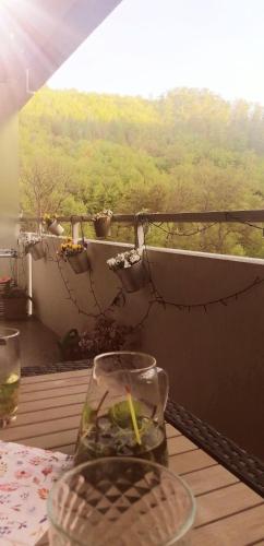 a glass vase sitting on a table in front of a window at Urlaub mit Sauna und Pool ist cool! in Bad Harzburg