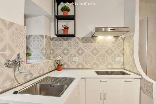 a kitchen with a sink and a counter top at La Grotta in Vernazza