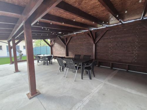 a patio with a table and chairs in a building at Vila Dionysos Brasov in Braşov