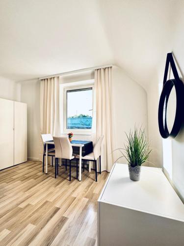 a kitchen and dining room with a table and chairs at Spacious 6BR Shared Villa with Garden near Danube For 16 Guests in Vienna