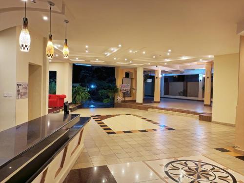 a large living room with a lobby with a couch at Stunning beachfront 2 bedroom apartment in Mombasa