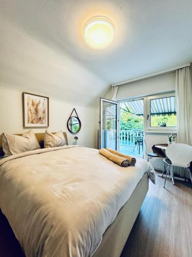 a bedroom with a large bed with a large window at Spacious 6BR Shared Villa with Garden near Danube For 16 Guests in Vienna