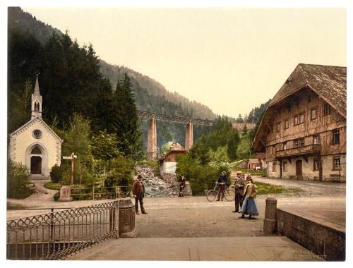 a painting of a village with a bridge in the background at Hotel Hofgut Sternen - Ravennaschlucht in Breitnau