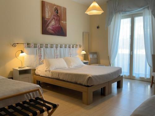Postel nebo postele na pokoji v ubytování B&B Eremes