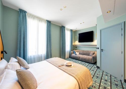 Letto o letti in una camera di Hôtel CASA MOHO - Juan-Les-Pins