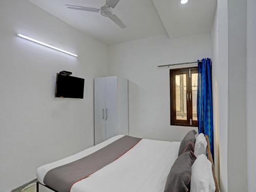 Ένα ή περισσότερα κρεβάτια σε δωμάτιο στο The Pinaki Residency