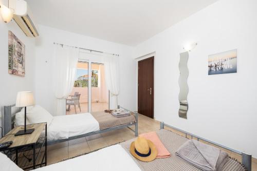 Ένα ή περισσότερα κρεβάτια σε δωμάτιο στο Villa Maia