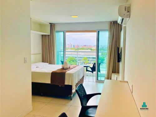 a hotel room with a bed and a large window at Fortaleza Sul Flats Service by Holiday Stays in Fortaleza