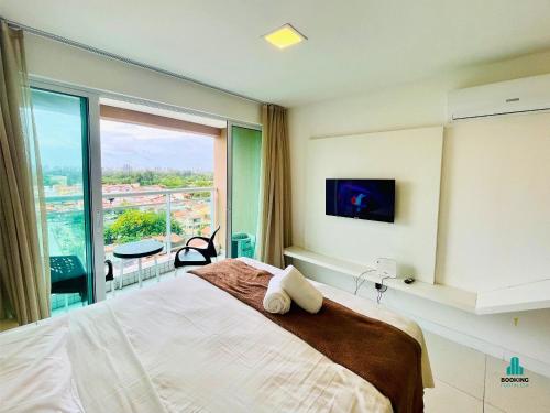 a bedroom with a large bed and a large window at Fortaleza Sul Flats Service by Holiday Stays in Fortaleza