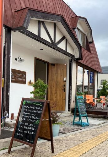 a restaurant with a sign in front of a building at YUKARA LEAF OLDGE - Vacation STAY 29791v in Ōnuma