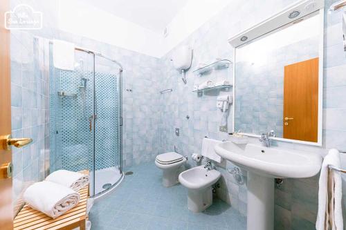 a bathroom with a sink and a toilet and a shower at Villa San Lorenzo in Scala