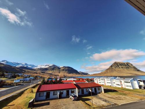 a view of a town with mountains in the background at The Old Post Office Guesthouse in Grundarfjordur