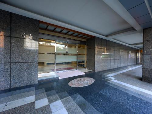 a lobby of a building with a bench on the floor at 華麗大飯店Ferrary Hotel in Taipei