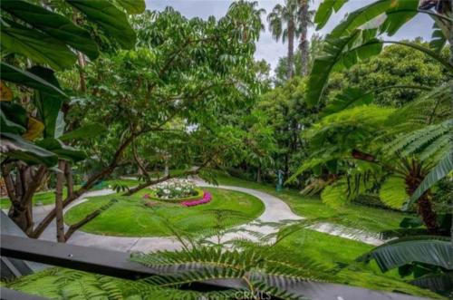 a garden with a pathway and a park with trees at CLOUD NINE - Elegance & Comfort in Irvine