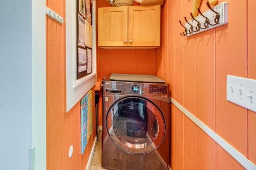 a washer and dryer in a small room at Walk to Winema Road Beach Home with Hot Tub! in Cloverdale