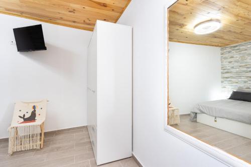 Μια τηλεόραση ή/και κέντρο ψυχαγωγίας στο Home2Book Peaceful Apt & Sea View Terrace in Arico