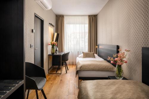 Postel nebo postele na pokoji v ubytování Hotel Aida