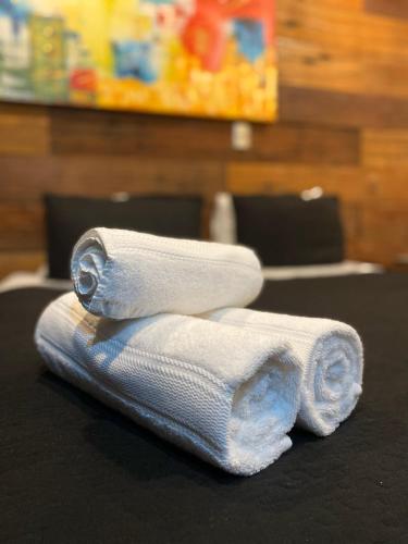 two rolled towels sitting on top of a table at Tremo Bustamante in Santiago
