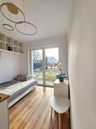 Postel nebo postele na pokoji v ubytování SmartRooms Hop to Wrocław