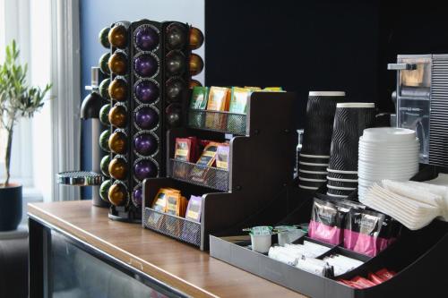 a counter top with a bunch of food on at Citysteps Hotels Newcastle West in Newcastle upon Tyne