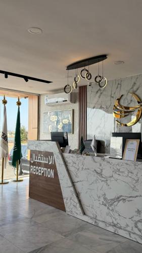 a lobby of a hotel with a reception counter at SEAVIEW HOTEL in Umm Lujj