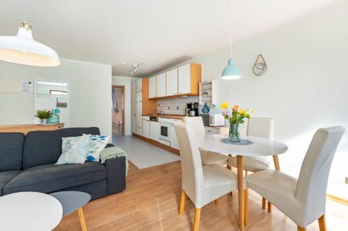 a living room with a couch and a table at Küstenkind in Westerholz