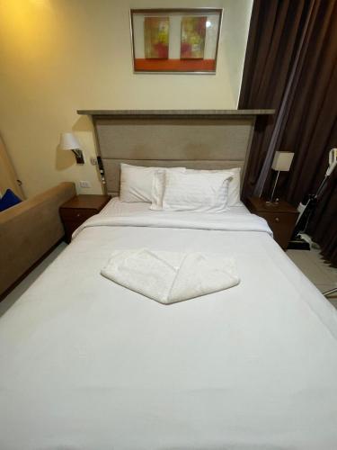 Una cama o camas en una habitación de Antel Spa Residences 9D