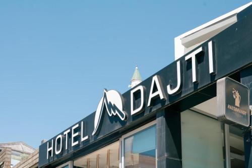 a sign for the hotel dallas on top of a building at Hotel Dajti in Ulcinj